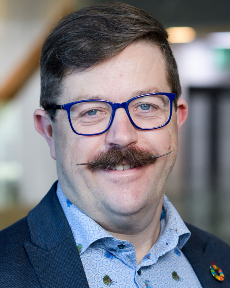 Porträttfoto av en man.