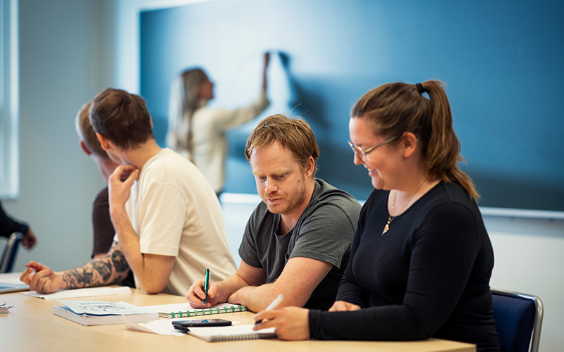 Students in a class room. Photo.